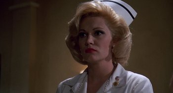 Movie still from “Matinee” (1993), directed by Joe Dante – A person wearing a uniform; Close Up shot, Low angle