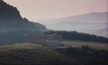 Movie still from “Maurice” (1987), directed by James Ivory – An ancient greek temple sits on a hill overlooking a valley; Extreme Wide shot, Low angle