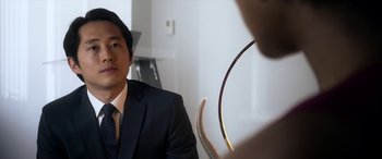Movie still from “Mayhem” (2017), directed by Joe Lynch – A man in a suit and tie looking into a mirror; Close Up shot, Over the shoulder angle
