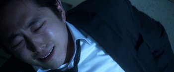 Movie still from “Mayhem” (2017), directed by Joe Lynch – A person wearing a shirt and a tie; Close Up shot, High angle