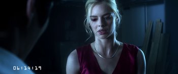 Movie still from “Mayhem” (2017), directed by Joe Lynch – A beautiful blonde haired woman wearing a red dress; Close Up shot, Low angle