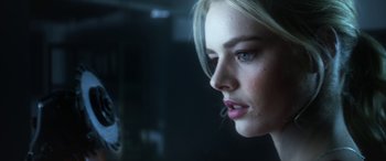 Movie still from “Mayhem” (2017), directed by Joe Lynch – A woman's face in a dark room; Close Up shot, Low angle