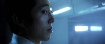 Movie still from “Mayhem” (2017), directed by Joe Lynch – A man's face in the dark; Close Up shot, Low angle