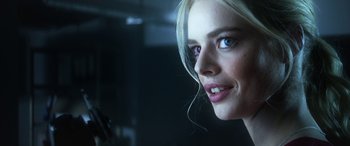 Movie still from “Mayhem” (2017), directed by Joe Lynch – A woman's face in a dark room; Close Up shot, Over the shoulder angle