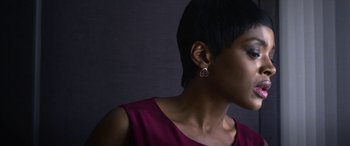 Movie still from “Mayhem” (2017), directed by Joe Lynch – A person wearing a purple shirt; Close Up shot, Low angle