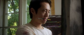 Movie still from “Mayhem” (2017), directed by Joe Lynch – A young man with two pencils in his mouth; Close Up shot, Low angle