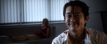 Movie still from “Mayhem” (2017), directed by Joe Lynch – A man with blood all over his face and a woman with blood all over his face; Close Up shot, Over the shoulder angle