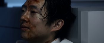 Movie still from “Mayhem” (2017), directed by Joe Lynch – A person's face covered in blood; Close Up shot, Over the shoulder angle