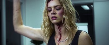 Movie still from “Mayhem” (2017), directed by Joe Lynch – A woman with blood all over her face and neck; Close Up shot, Low angle