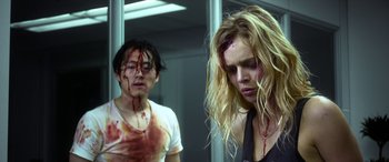 Movie still from “Mayhem” (2017), directed by Joe Lynch – A man and a woman with blood all over their faces; Close Up shot, Low angle