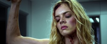 Movie still from “Mayhem” (2017), directed by Joe Lynch – A young woman with blood all over her face; Close Up shot, Low angle