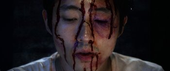 Movie still from “Mayhem” (2017), directed by Joe Lynch – A man with blood dripping down his face; Extreme Close Up shot, Overhead angle