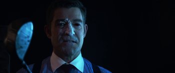 Movie still from “Mayhem” (2017), directed by Joe Lynch – A person wearing a suit and tie; Close Up shot, Over the shoulder angle