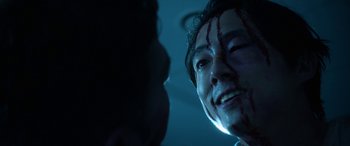 Movie still from “Mayhem” (2017), directed by Joe Lynch – A man with blood all over his face; Close Up shot, Over the shoulder angle