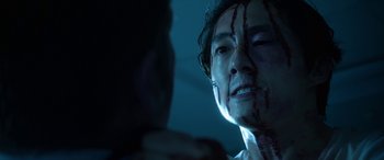 Movie still from “Mayhem” (2017), directed by Joe Lynch – A man with blood all over his face and neck; Close Up shot, Over the shoulder angle