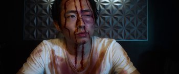 Movie still from “Mayhem” (2017), directed by Joe Lynch – A man with blood on his face and chest; Close Up shot, High angle