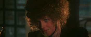 Movie still from “McCabe & Mrs. Miller” (1971), directed by Robert Altman – A person wearing a hat; Close Up shot, Over the shoulder angle
