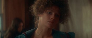 Movie still from “McCabe & Mrs. Miller” (1971), directed by Robert Altman – A person wearing a blue shirt; Close Up shot, Over the shoulder angle