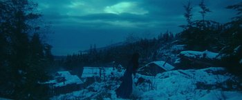 Movie still from “McCabe & Mrs. Miller” (1971), directed by Robert Altman – A woman standing in the middle of a snow covered field; Extreme Wide shot, High angle