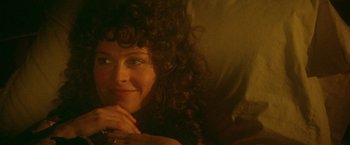 Movie still from “McCabe & Mrs. Miller” (1971), directed by Robert Altman – A person with curly hair; Close Up shot, Over the shoulder angle