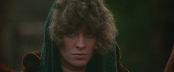 Movie still from “McCabe & Mrs. Miller” (1971), directed by Robert Altman – A person wearing a hat and a scarf; Close Up shot, Low angle