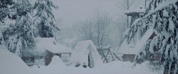 Movie still from “McCabe & Mrs. Miller” (1971), directed by Robert Altman – A snowy scene with a tent in the foreground; Extreme Wide shot, High angle