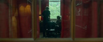 Movie still from “Me and Earl and the Dying Girl” (2015), directed by Alfonso Gomez-Rejon – A man and a woman looking out of a window; Wide shot, Over the shoulder angle