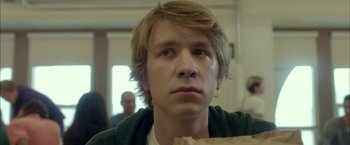 Movie still from “Me and Earl and the Dying Girl” (2015), directed by Alfonso Gomez-Rejon – A person holding a paper bag; Close Up shot, Over the shoulder angle
