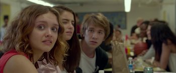 Movie still from “Me and Earl and the Dying Girl” (2015), directed by Alfonso Gomez-Rejon – A group of young people sitting at a table; Close Up shot, Over the shoulder angle