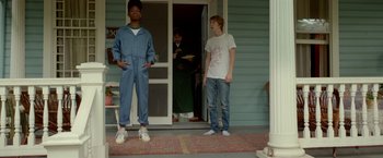 Movie still from “Me and Earl and the Dying Girl” (2015), directed by Alfonso Gomez-Rejon – Two young men standing in front of a house; Medium shot, Low angle
