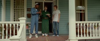 Movie still from “Me and Earl and the Dying Girl” (2015), directed by Alfonso Gomez-Rejon – A group of young men standing on a porch; Medium shot, Low angle