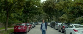 Movie still from “Me and Earl and the Dying Girl” (2015), directed by Alfonso Gomez-Rejon – A man standing in the middle of a parking lot; Wide shot, Over the shoulder angle