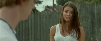 Movie still from “Me and Earl and the Dying Girl” (2015), directed by Alfonso Gomez-Rejon – A young woman standing in front of a fence; Close Up shot, Over the shoulder angle