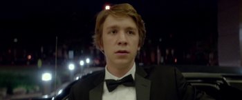 Movie still from “Me and Earl and the Dying Girl” (2015), directed by Alfonso Gomez-Rejon – A young man in a suit and a bow tie; Close Up shot, Low angle