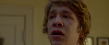 Movie still from “Me and Earl and the Dying Girl” (2015), directed by Alfonso Gomez-Rejon – A young man's face with a sad look on his face; Close Up shot, Low angle