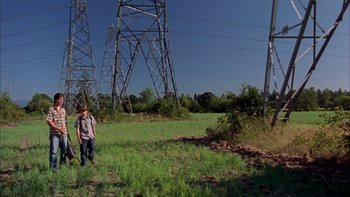 Movie still from “Mean Creek” (2004), directed by Jacob Estes – A man standing in the middle of an open field; Wide shot, Low angle