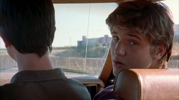 Movie still from “Mean Creek” (2004), directed by Jacob Estes – Two young men sitting in the drivers seat of a car looking out the window; Close Up shot, Over the shoulder angle