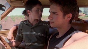 Movie still from “Mean Creek” (2004), directed by Jacob Estes – Two young men are talking in the back of a vehicle; Close Up shot, Over the shoulder angle