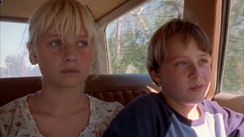Movie still from “Mean Creek” (2004), directed by Jacob Estes – Two young children sitting in the back of a car; Close Up shot, Low angle