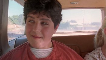 Movie still from “Mean Creek” (2004), directed by Jacob Estes – A young man sitting in a car looking at the camera; Close Up shot, High angle