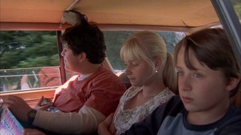 Movie still from “Mean Creek” (2004), directed by Jacob Estes – A group of people riding in the back of a vehicle; Close Up shot, High angle