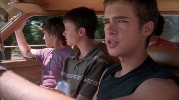 Movie still from “Mean Creek” (2004), directed by Jacob Estes – Three young men sitting in the back of a truck; Medium shot, Low angle