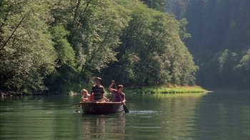 Movie still from “Mean Creek” (2004), directed by Jacob Estes – A group of people in a boat on a river; Extreme Wide shot, High angle