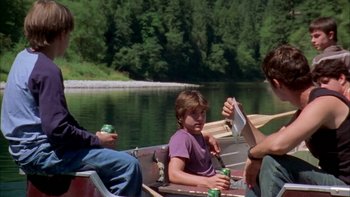 Movie still from “Mean Creek” (2004), directed by Jacob Estes – A group of people in a row boat on a river; Wide shot, High angle
