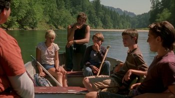 Movie still from “Mean Creek” (2004), directed by Jacob Estes – A group of people sitting in a boat on a river; Wide shot, High angle