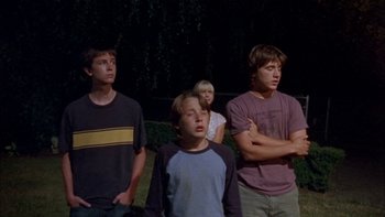 Movie still from “Mean Creek” (2004), directed by Jacob Estes – A group of young people standing next to each other; Medium shot, Low angle