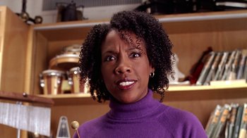 Movie still from “Mean Girls” (2004), directed by Mark Waters – A person wearing a purple shirt; Close Up shot, Low angle