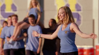 Movie still from “Mean Girls” (2004), directed by Mark Waters – A woman that is dancing in the street; Wide shot, Low angle