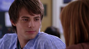 Movie still from “Mean Girls” (2004), directed by Mark Waters – A young man is looking into the distance; Close Up shot, Over the shoulder angle