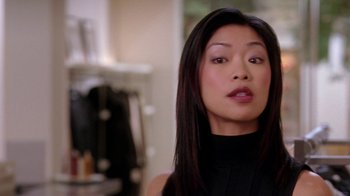 Movie still from “Mean Girls” (2004), directed by Mark Waters – A person with long black hair; Close Up shot, Over the shoulder angle